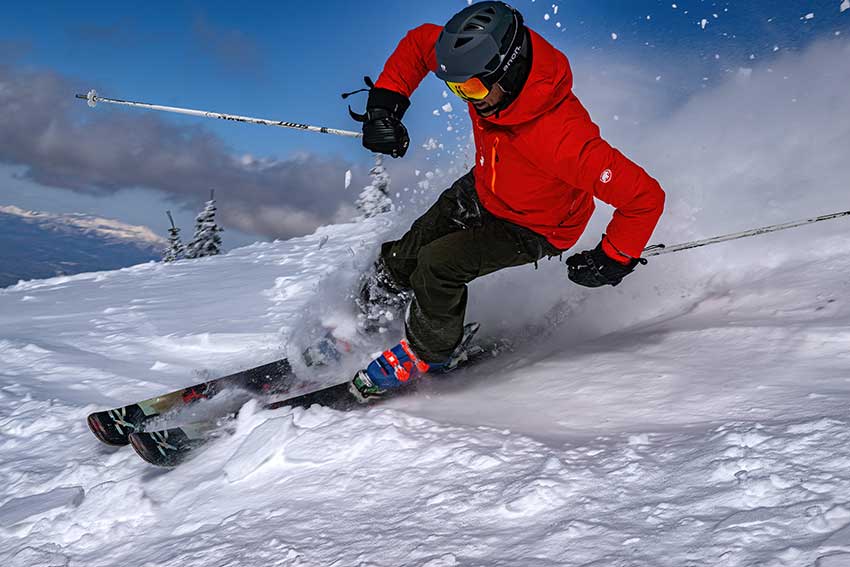 A skier flashes a turn in soft snow at Ski Santa Fe. Photo credit: Mountain Standard Creative.