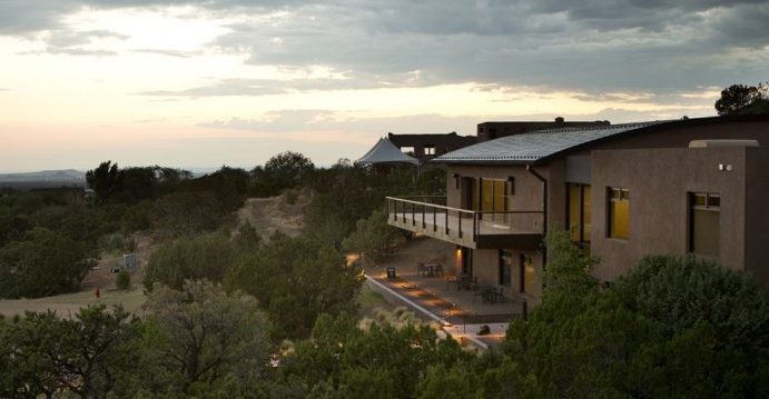 The Academy for the Love of Learning building at dusk.
