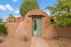 Entrance to home with adobe-look entrance gate. Homes like this may be found in the Artist-Hyde Road neighborhood.