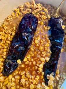 Corn simmered with red chile pods at Atrisco's.