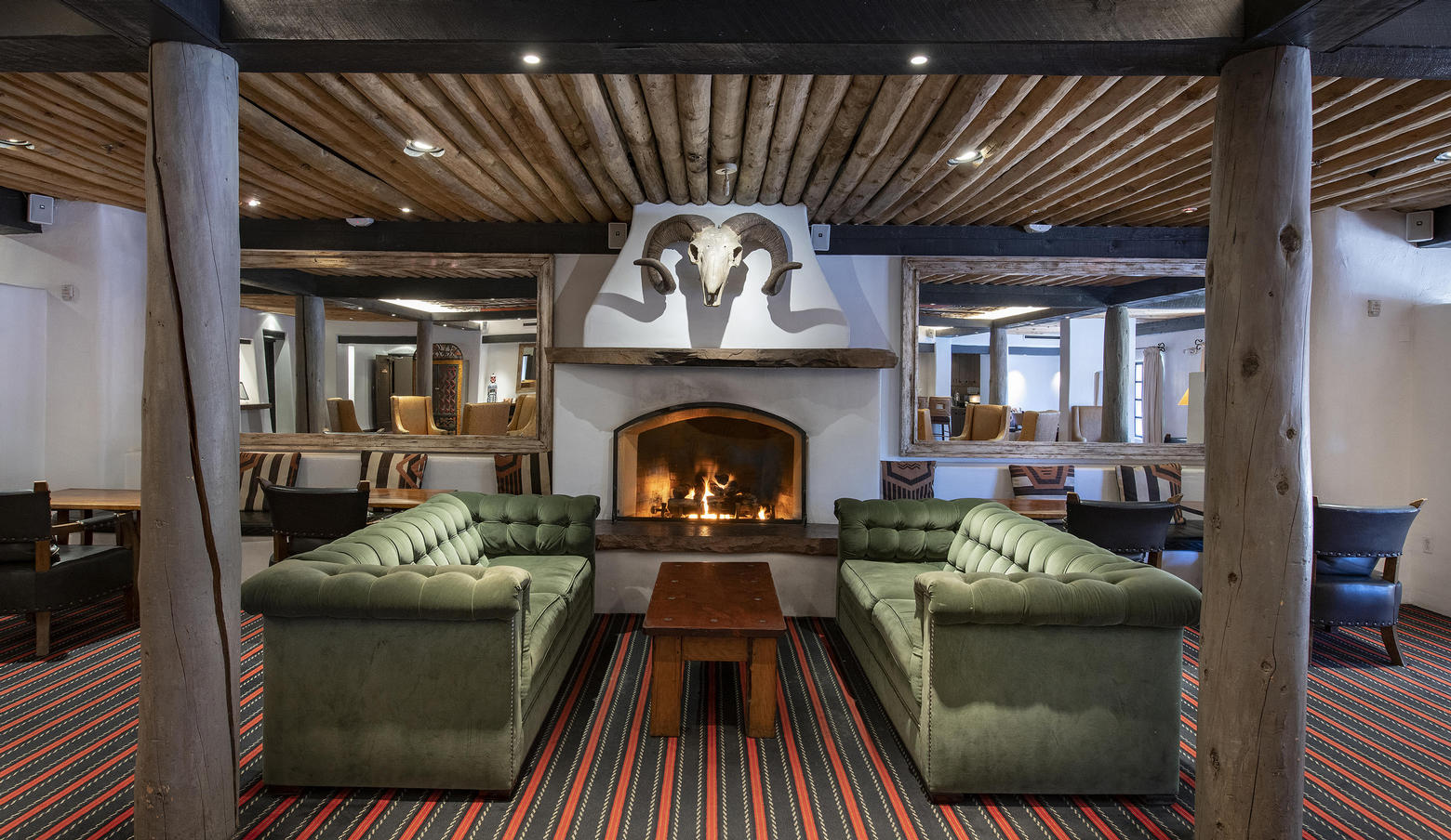 The Living Room at Loretto with comfortable seating and Southwestern decor.