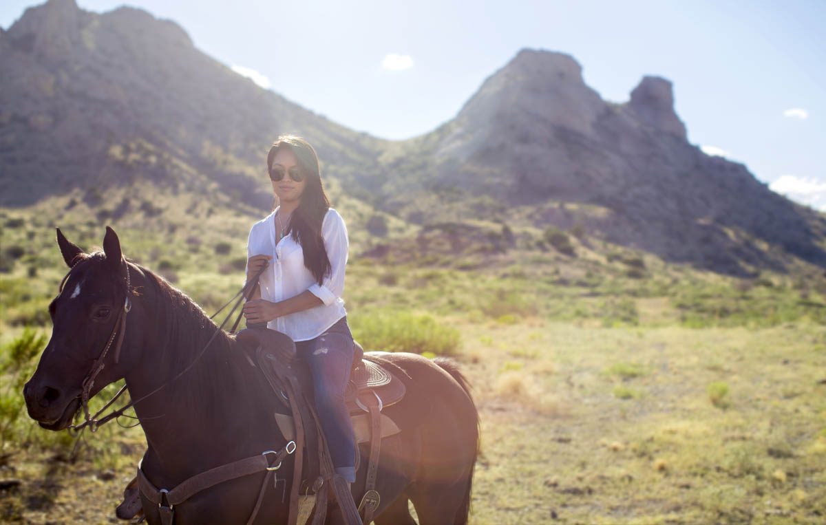 Woman on horseback near Deming, New Mexico