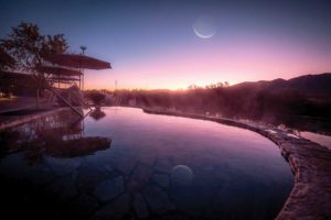 Riverbend Hot Springs at sunset with moon