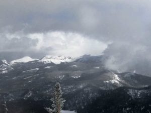 Clouds over snow-covered mountains