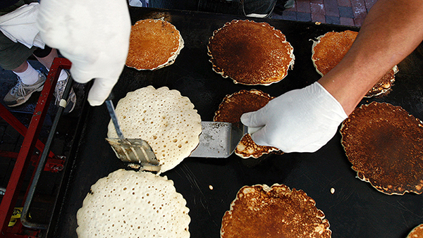 pancakes cooking on the flat top